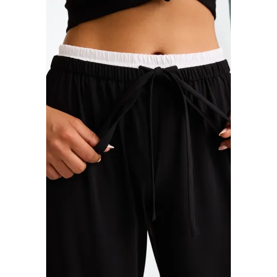 Jane Lushka.Antiny strech technical jersey pants. Black with white stripe